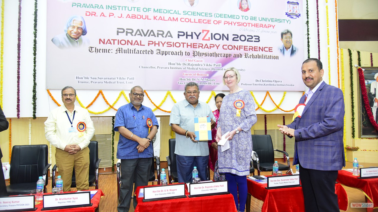 Dr Cristina Opava, Professor Karolinska Institute, Sweden handing over the book momento to Hon'ble Chancellor Dr Rajendra E Vikhe Patil